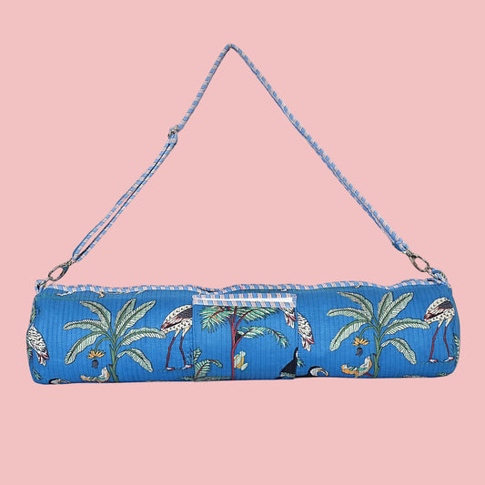 Blue yoga mat bag with tropical design on a white background