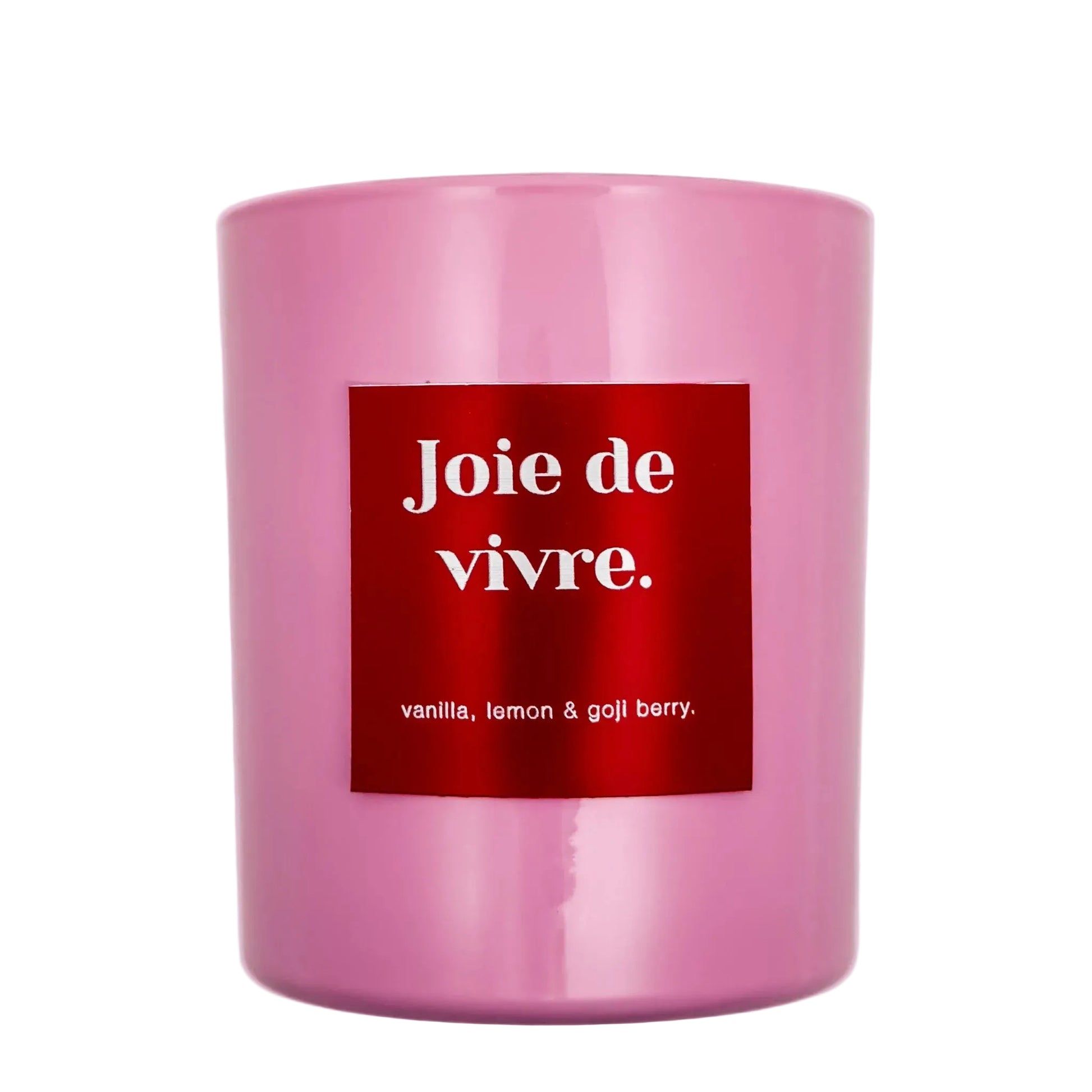 Pink candle with a red label displaying 'Joie de vivre' on a white background